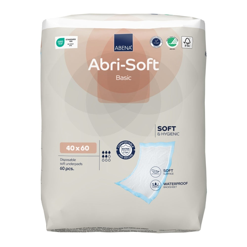 Ein Bild zeigt die Abri Soft Basic Einwegunterlage in der Größe 40 x 60 cm. Die Unterlage ist in einem sanften, blassen Farbton gehalten und hat eine weiche, saugfähige Oberfläche. Sie ist auf einer neutralen, hellen Oberfläche platziert, um ihre Textur und Beschaffenheit hervorzuheben. Die Ränder der Unterlage sind leicht wellig und die Oberfläche ist glatt, was auf ihre Verwendung für Hygiene- und Pflegeanwendungen hinweist. Ideal für den Einsatz in der Altenpflege oder bei der Haustierpflege.