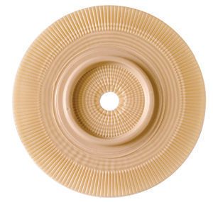 Bild eines Assura Basisplatte-Produkts mit den Maßen 60 x 10 x 55 mm. Die Basisplatte ist in einem klaren, modernen Design gehalten und hat eine ansprechende, matte Oberfläche. In der Mitte befindet sich ein ovalschnittförmiges Aperture, das für einen Hautkontakt sorgt. Die Ecken der Platte sind leicht abgerundet. Die Farben sind dezent in Hellbeige und Sandtönen gehalten, was eine sanfte Ausstrahlung erzeugt.