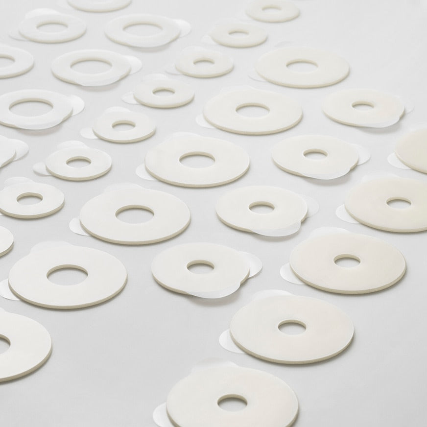 Vielzahl an Brava Hautschutzringen Plus in verschiedenen Größen – flach ausgelegt zur Größenübersicht.