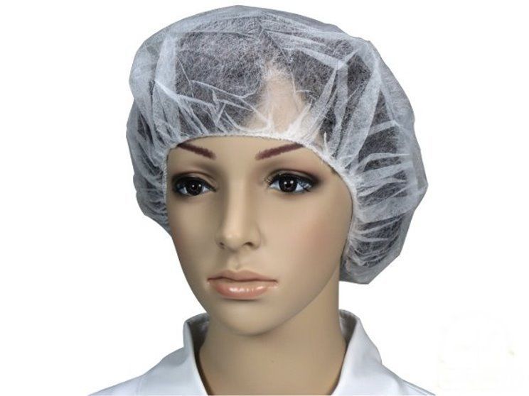 Weißes Vlies-Baretthaube mit einem Durchmesser von 60 cm, ideal für den hygienischen Schutz im medizinischen und gastronomischen Bereich. Die Haube hat einen elastischen Rand, der einen sicheren Sitz gewährleistet. Sie ist leicht und atmungsaktiv, wodurch ein hoher Tragekomfort entsteht. Die Oberfläche ist glatt, ohne sichtbare Nähte, und das Material wirkt strapazierfähig.