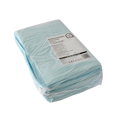 Bild zeigt eine Packung mit Einmalunterlagen aus 6-lagigem Material in der Größe 60 x 90 cm. Die Unterlagen sind in einer neutralen weißen Farbe gehalten und in einem transparenten Kunststoffbeutel verpackt, welcher mit einem gelben Aufkleber versehen ist. Der Aufkleber zeigt das Produktlogo sowie wichtige Informationen wie die Materialbeschreibung und die Anzahl der Schichten. Im Hintergrund sind unscharfe Elemente zu erkennen, die eine Pflegeumgebung andeuten.