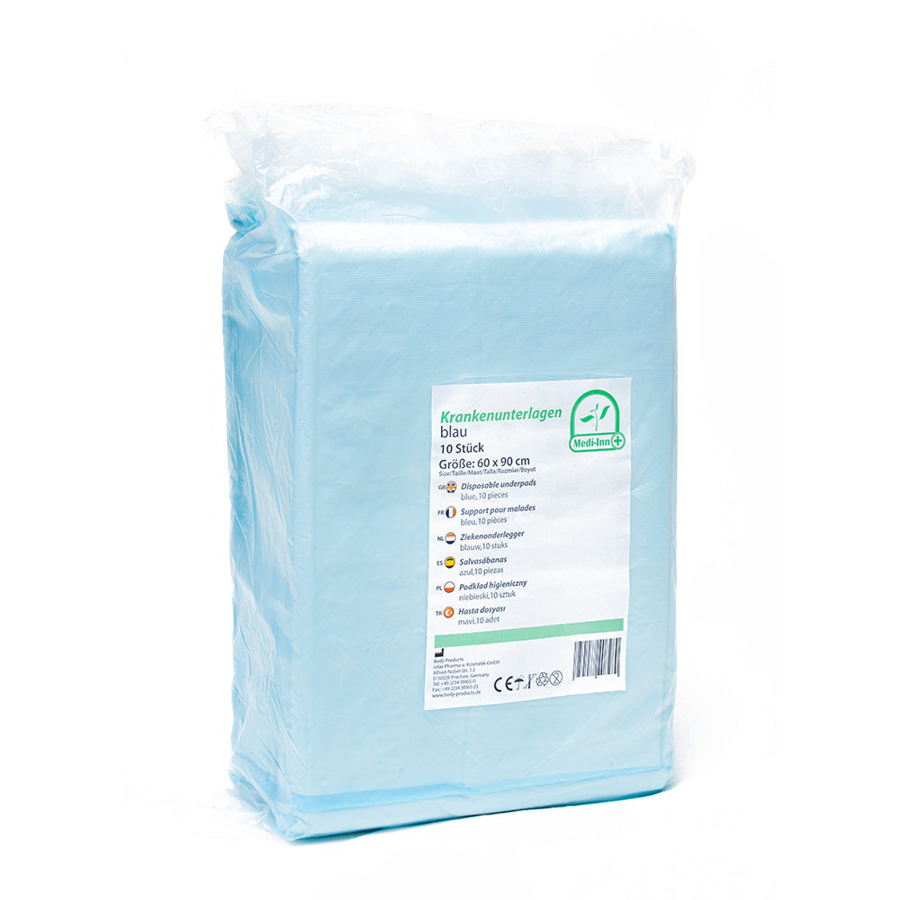 Ein Paket mit einer großen Rolle aus hochwertigen, einlagigen, wasserfesten Krankenunterlagen in der Größe 60 x 90 cm. Die Unterlagen sind in einer klaren Folie verpackt, die den Inhalt schützt und die Farbe der Unterlagen zeigt, ein sanftes Blau. Die Packung ist offen, sodass die einzelnen Lagen sichtbar sind. Links im Bild befindet sich eine stilisierte Darstellung der verschiedenen Anwendungsbereiche, wie z. B.