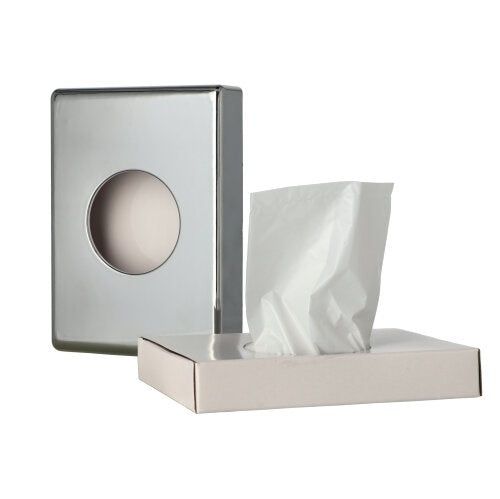 Ein hygienischer Beutelspender aus glänzendem Chrom steht vor einem neutralen Hintergrund auf einem Holztisch. Der Spender hat eine rechteckige Form mit einer leicht gebogenen Oberseite und einer Öffnung für die Beutel. Fünf Packungen mit jeweils 30 Hygienetüten sind neben dem Spender angeordnet, die ebenfalls in der Farbe Weiß gehalten sind. Die Verpackungen sind mit einem einfachen Design versehen, das die Verwendung der Beutel zur Aufbewahrung von Hygieneartikeln anzeigt.