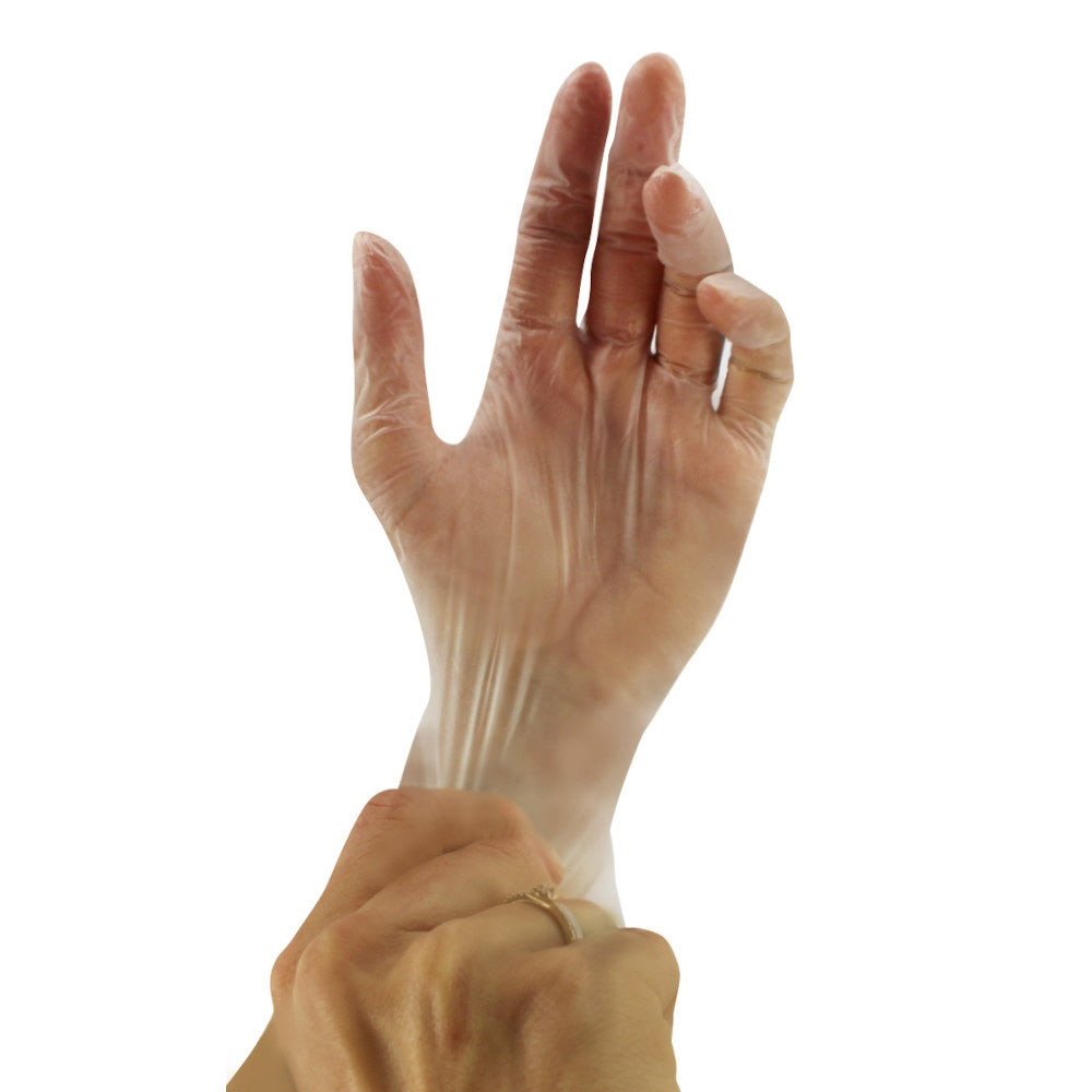 Ein weißer Karton mit der Aufschrift „Medi Inn Vinyl Comfort Einmalhandschuhe“ ist auf einer neutralen Oberfläche zu sehen. Der Karton enthält 100 puderfreie Einmalhandschuhe in der Größe M (7-8). Die Vorderseite zeigt ein grafisches Design und das Herstellungslogo, während die seitlichen Ansichten Hinweise zur Verwendung und den Materialien zeigen. Die Handschuhe sind elastisch und bieten eine hohe Beweglichkeit. Der Hintergrund ist hell, wodurch der Karton und die Handschuhe klar hervorgehoben werden.