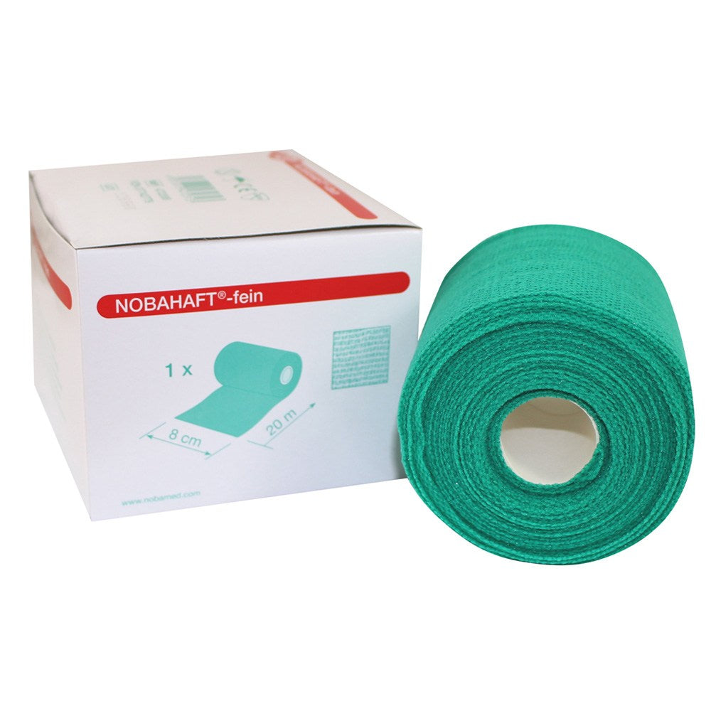 Grünes, elastisches Fixierband von Noba mit feiner Kohäsion, dargestellt auf einem neutralen Hintergrund. Das Band ist in einem breiten, mittleren Format gerollt und zeigt eine leicht strukturierte Oberfläche. Die Verpackung ist entweder teilweise sichtbar oder das Band selbst ist in einer offenen Position, wobei die flexiblen Eigenschaften und die Kohäsion deutlich zur Geltung kommen. Ideal zum Fixieren von Verbänden, medizinischen Materialien oder zur Stabilisierung von Verletzungen.