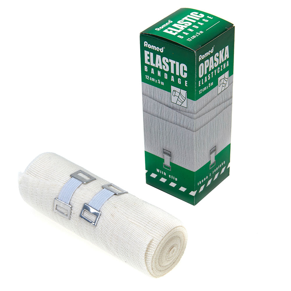 Ein Produktbild zeigt eine transparente Verpackung mit einer elastischen Fixierbinde. Diese ist in der Größe 10 cm x 5 m und wird als "romed elastische Mittelzugbinden" bezeichnet. In der Verpackung sind die Binden ordentlich aufgewickelt. Eine graue Halteklammer zur Fixierung ist ebenfalls zu sehen, was die Handhabung erleichtert. Das Produkt eignet sich zur Stabilisierung und Fixierung von Verbänden. Der Hintergrund ist neutral, wodurch das Produkt klar im Fokus steht.