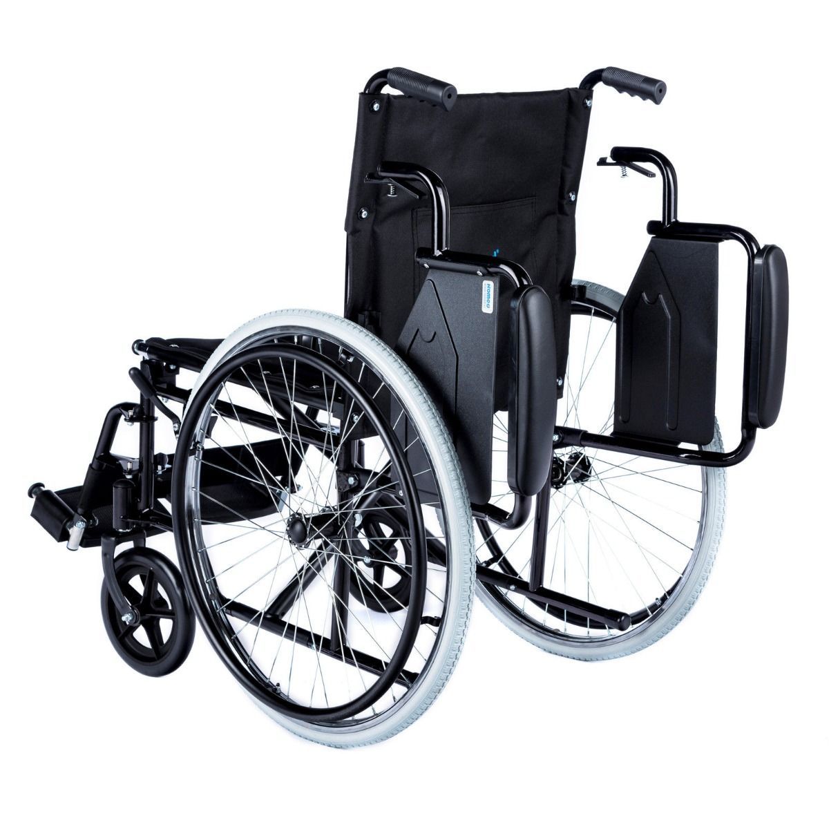 Manueller Rollstuhl, Modell Dynamic, mit einer Sitzbreite von 46 cm. Der Rollstuhl ist faltbar und zeigt ein modernes, ergonomisches Design. Die Rückenlehne ist leicht geneigt und bietet zusätzlichen Komfort. Die Sitze sind gepolstert und in einem ansprechenden Farbton gehalten. Die Armlehnen sind abnehmbar und höhenverstellbar. Vorderräder sind klein und wendig, während die Hinterräder größer sind, um Stabilität zu gewährleisten.